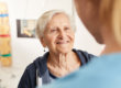 senior woman talking to nurse at assisted living for seniors