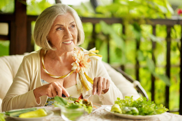 woman happy after avoiding credit scams