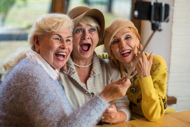 Remarkable Benefits of Laughter – Part 3 group of friends experiencing the benefits of laughter