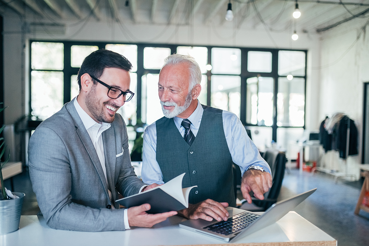 men discussing senior coupons
