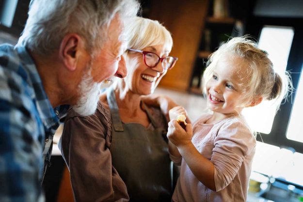 grandparents enjoying their family bonds with granddaughter