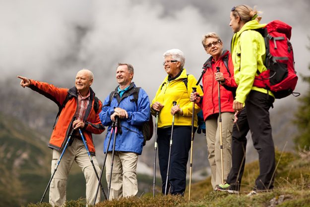senior hiker pointing at something