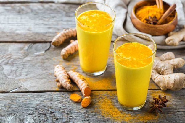 Traditional indian drink turmeric curcuma golden milk with ingredients Traditional indian drink turmeric curcuma golden milk with ingredients