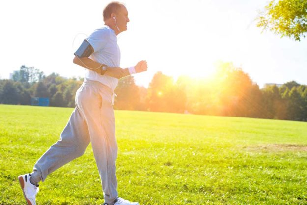 Active senior man running in park