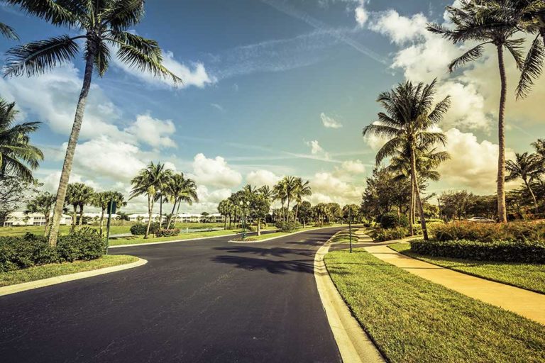 Gated community road and condominiums in Florida Gated community road and condominiums in South Florida