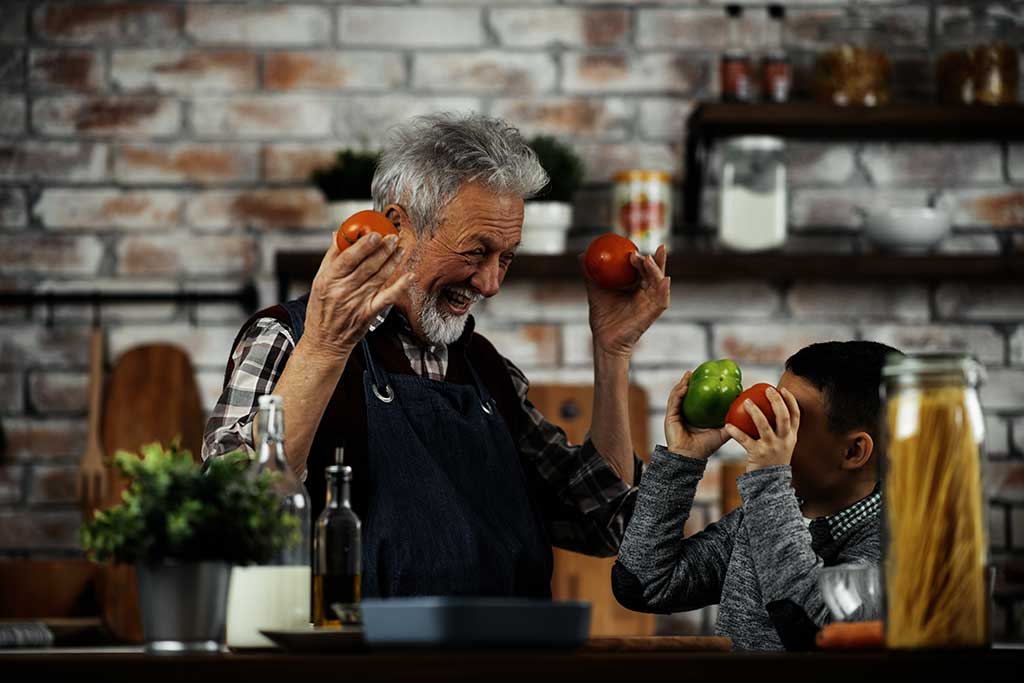 Grandpa and grandson in kitchen. Grandfather and his grandchild Grandpa and grandson in kitchen