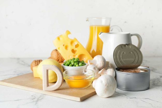 Letter D and different healthy products on light background Letter D and different healthy products