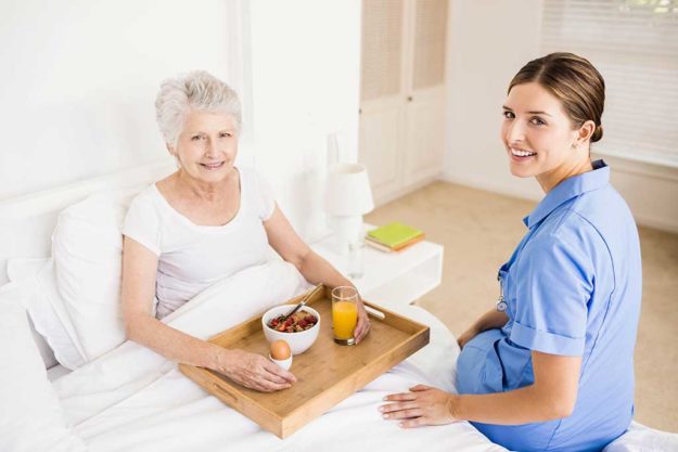 Nurse taking care of suffering senior patient Nurse taking care of suffering senior patient