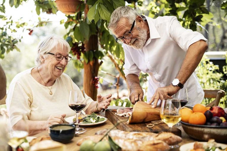 Senior couple having dinner outdoors Senior couple having dinner outdoors