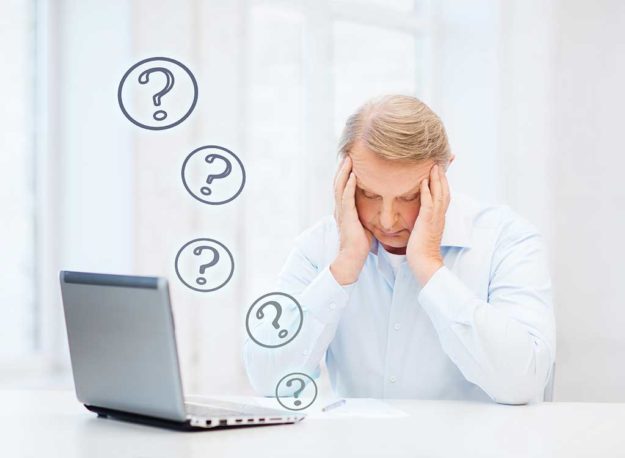 stressed old man filling a form at home stressed old man filling a form at home