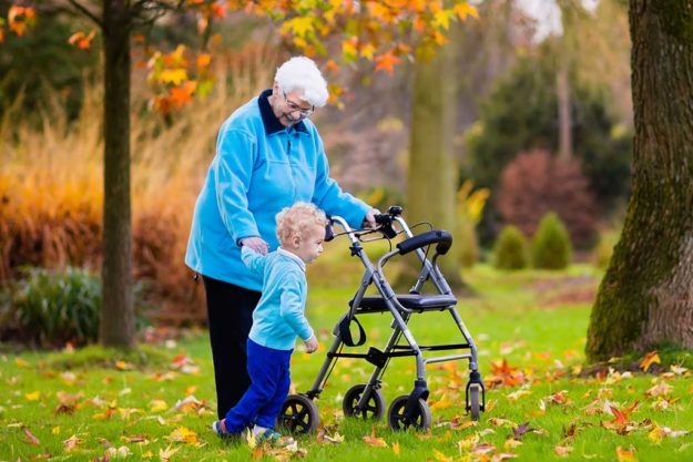 Senior lady with walker enjoying family visit Senior lady with walker enjoying family visit