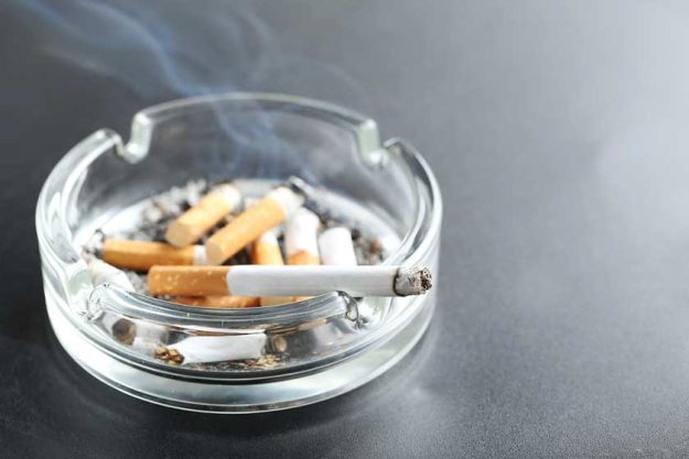 Cigarette butts in ashtray Cigarette butts in ashtray