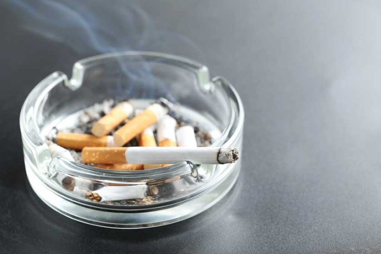 Cigarette butts in ashtray Cigarette butts in ashtray