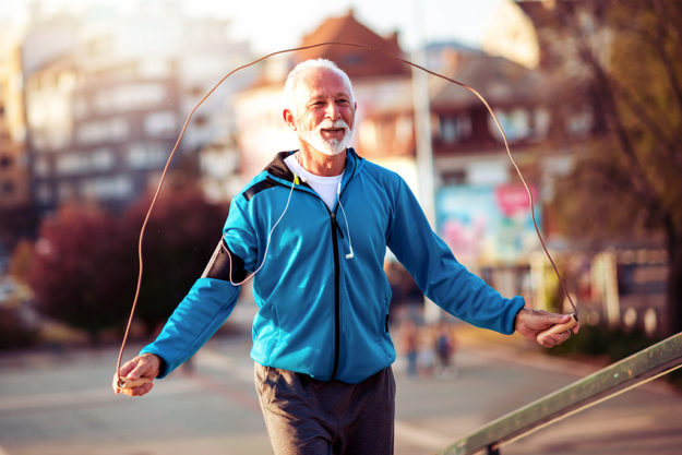 Senior fitness man doing workout outdoors