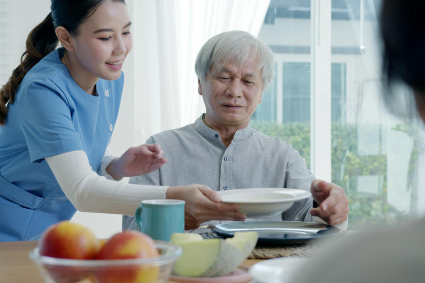 Attractive young senior asian citizen couple happy sit, talk, ea