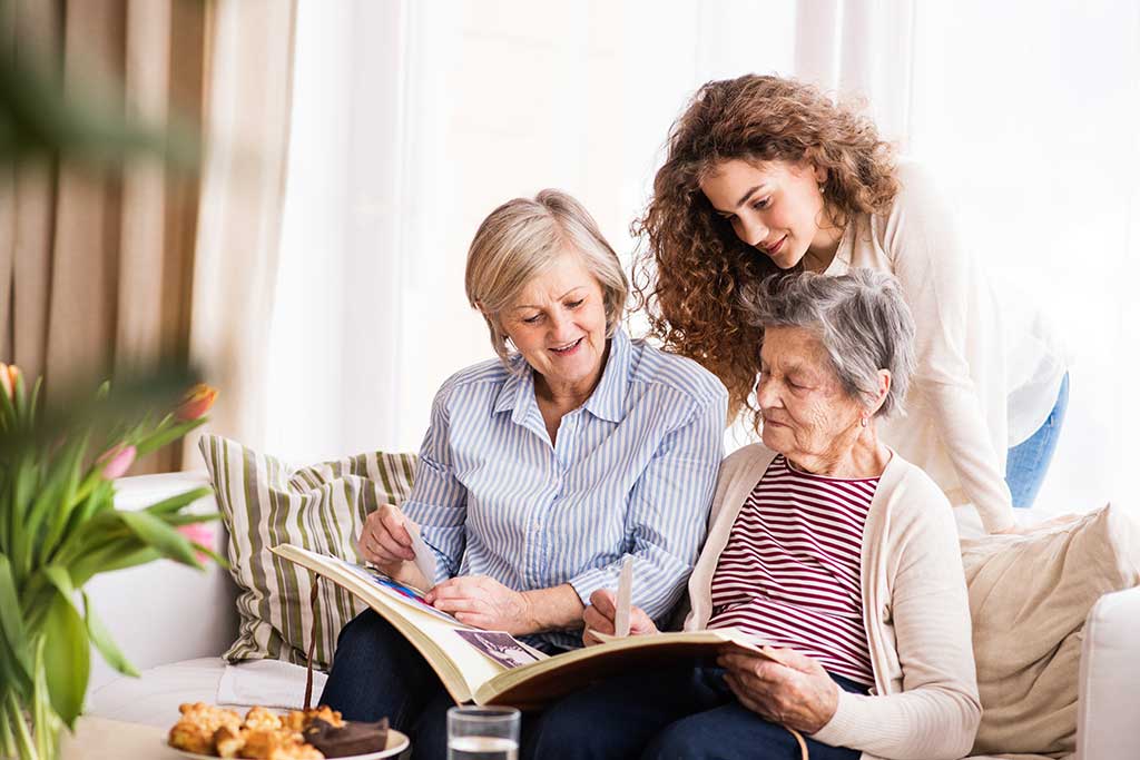 A teenage girl, mother and grandmother at home. A teenage girl, mother and grandmother at home.