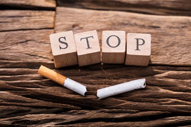 Cigarette And Wooden Blocks Showing Stop Word Cigarette And Wooden Blocks Showing Stop Word