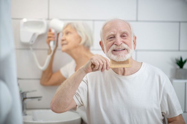 Elderly couple having their morning routine together Elderly couple having their morning routine together
