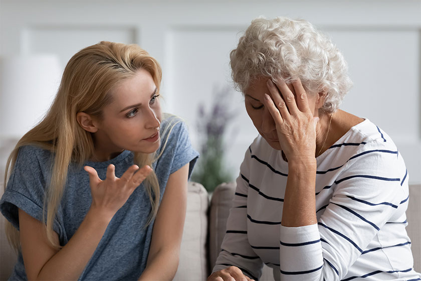 Family sit on couch having dispute, grown up daughter proves her right aggressively argue Family sit on couch having dispute, grown up daughter proves her right aggressively argue
