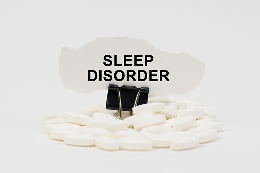 On a white surface are pills and torn paper On a white surface are pills and torn paper