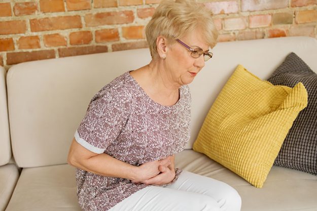 Senior woman having stomachache Senior woman having stomachache