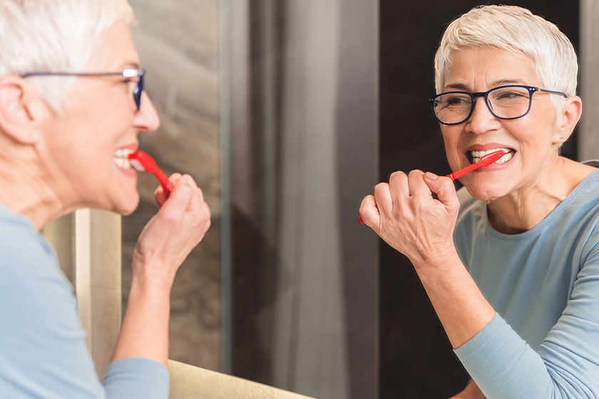 Woman brushing her teeth