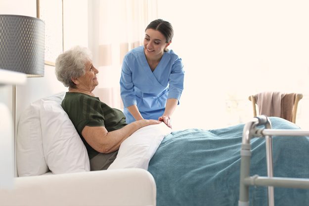 Care worker with elderly woman in geriatric hospice Care worker with elderly woman in geriatric hospice