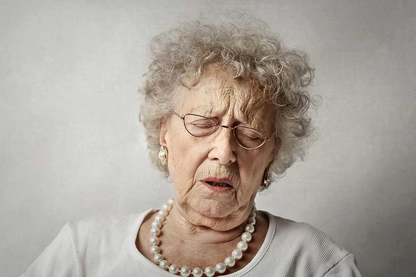 portrait of elderly lady with sore expression portrait of elderly lady with sore expression
