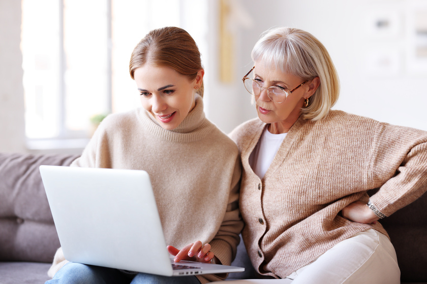 Mother and daughter using laptop together 3 Mistakes To Avoid When Talking To Parents About Moving To Bexar County, TX Assisted Living