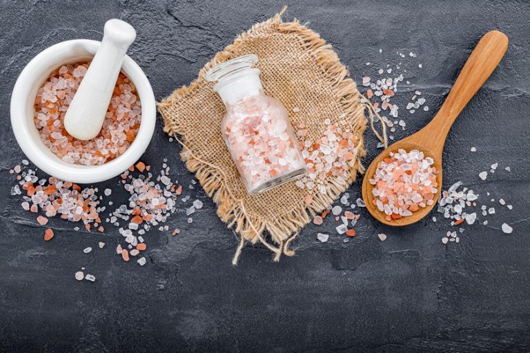 Himalayan pink salt on dark concrete background. Himalayan salt 4 Things To Know About Sodium Intake In Your Diet