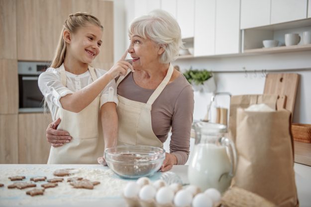 Cheerful family baking pastry together Cheerful family baking pastry together