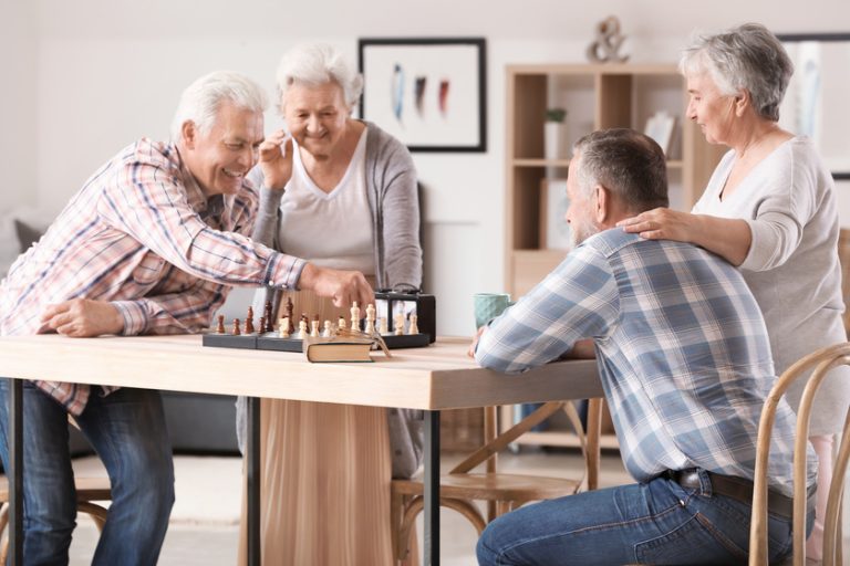 Elderly people playing chess in nursing home Elderly people playing chess in nursing home