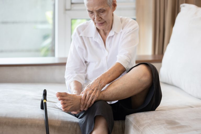 Old elderly with foot injuries,ankle bone diseases,heel pain or A Guide To Maintaining Your Aging Feet
