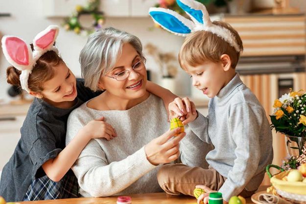 Happy easter! family grandmother and children grandchildren paint eggs for holiday. Happy easter! family grandmother and children grandchildren paint eggs for holiday.