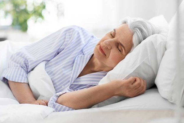 old age and people concept – senior woman sleeping in bed at home bedroom old age and people concept - senior woman sleeping in bed at home bedroom