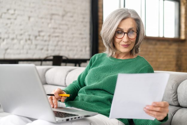Mature senior woman using a laptop at home Planning Your Retirement In Westchase, FL Assisted Living: A Step-By-Step Guide