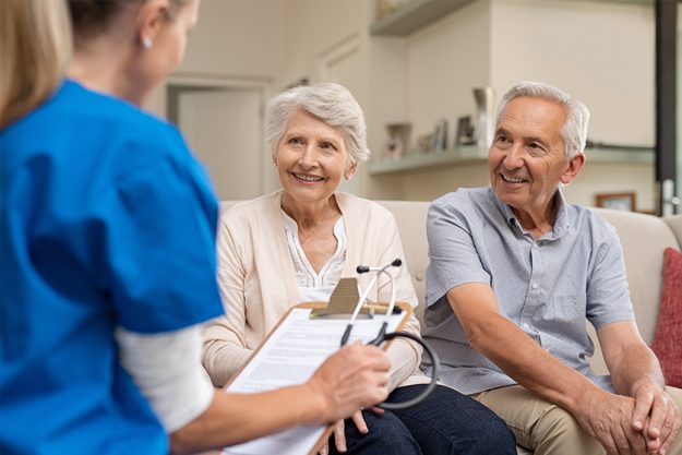 Senior couple consulting nurse Senior couple consulting nurse