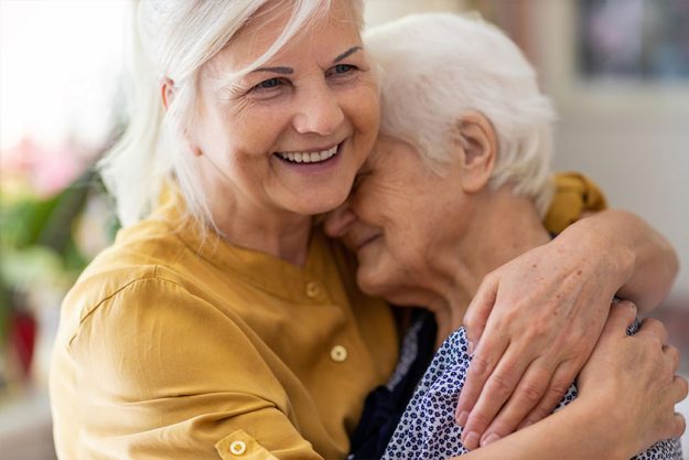 Woman spending time with her elderly mother Woman spending time with her elderly mother
