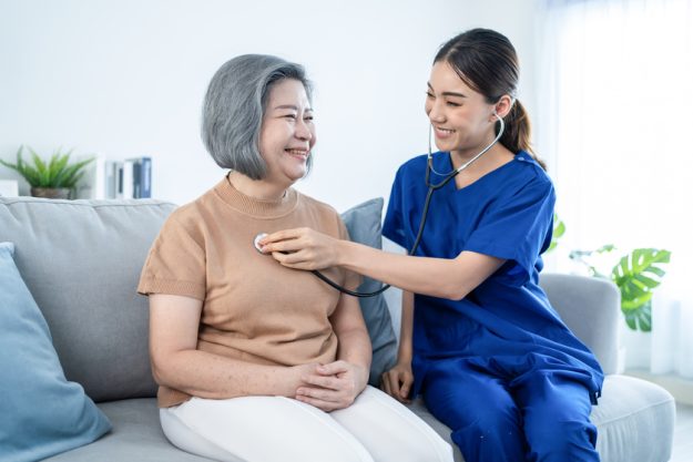 Asian nurse at nursing home take care of disabled senior elderly How To Choose Between 55+ Communities And Independent Living Near Florida Gardens, FL