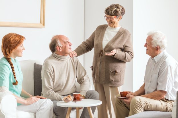 Friends at retirement club How To Decide Between Assisted Living And Memory Care Near Yamato, FL