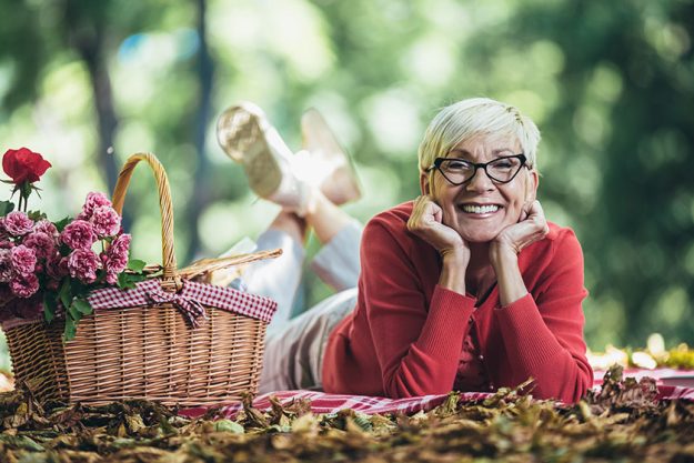 Portrait of senior woman at picnic in park Portrait of senior woman at picnic in park