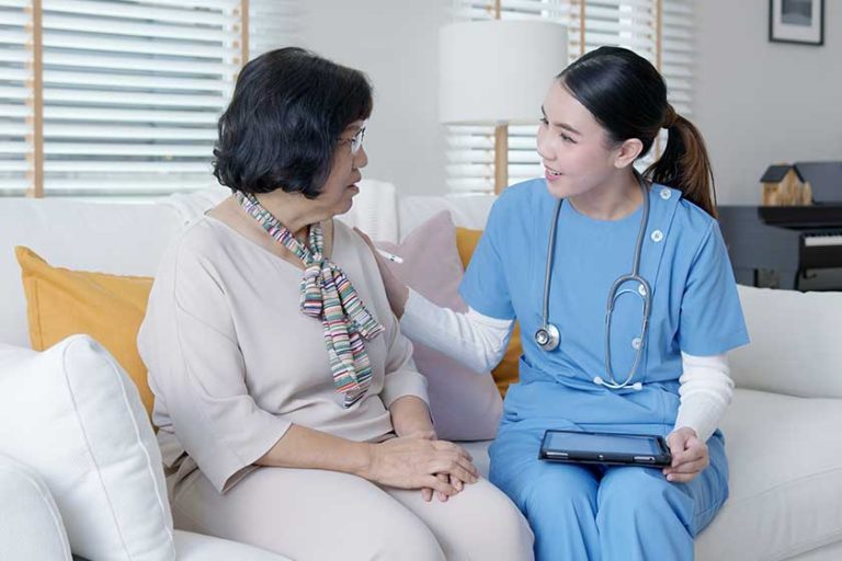 Young asia female nurse, assisted living, in-home carer or doctor visit old senior citizen