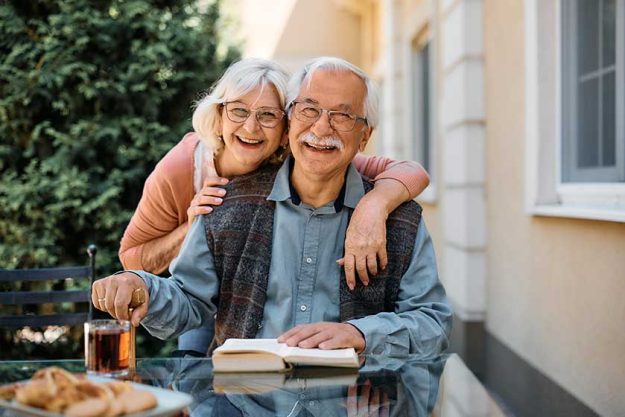 Happy senior couple at independent living community looking at camera. Happy senior couple at independent living community looking at camera.