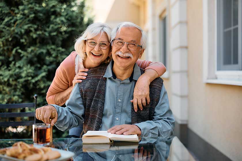 Happy senior couple at independent living community looking at camera. Happy senior couple at independent living community looking at camera.
