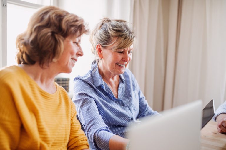 Senior women using laptops and tablets in community center club. How Learning New Skills In Independent Living In Estero, FL Can Raise The Quality Of Your Life