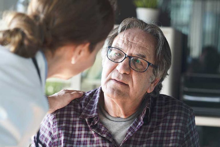 Doctor with patient in medical office