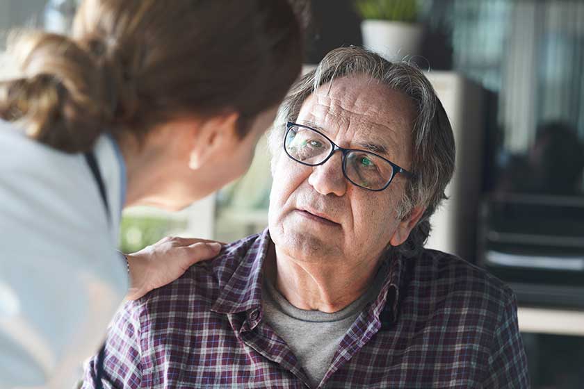 Doctor with patient in medical office