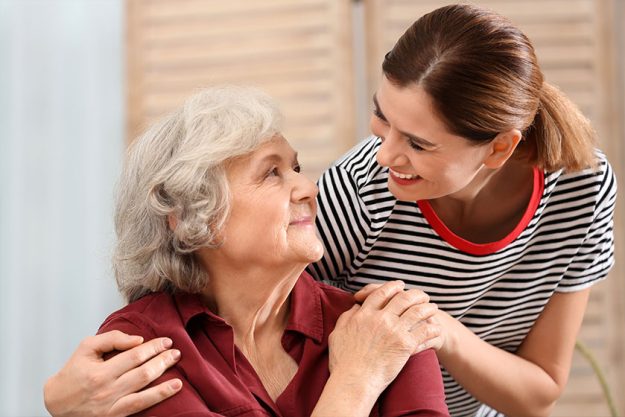 Elderly woman with female caregiver at home Elderly woman with female caregiver at home