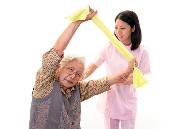 Nurse cares for an elderly woman