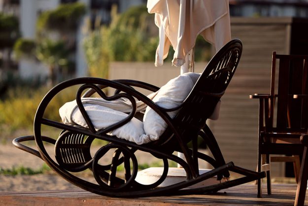 Rocking chair with pillows on the terrace Rocking chair with pillows on the terrace